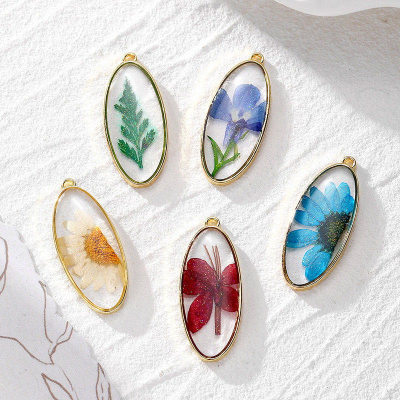 Wholesale 10pcs/pack Oval Glitter Daisy Dried Flower Flower Pendant DIY Alloy Epoxy Plant Earrings Necklace Keychain Accessories